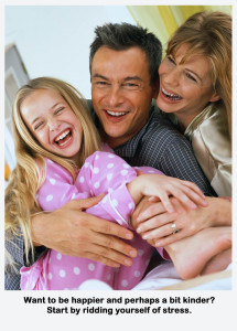 Happy Family Laughing in Bed